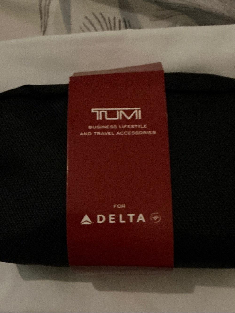 Tumi Black Toiletry Pouch with delta items, ballistic nylon